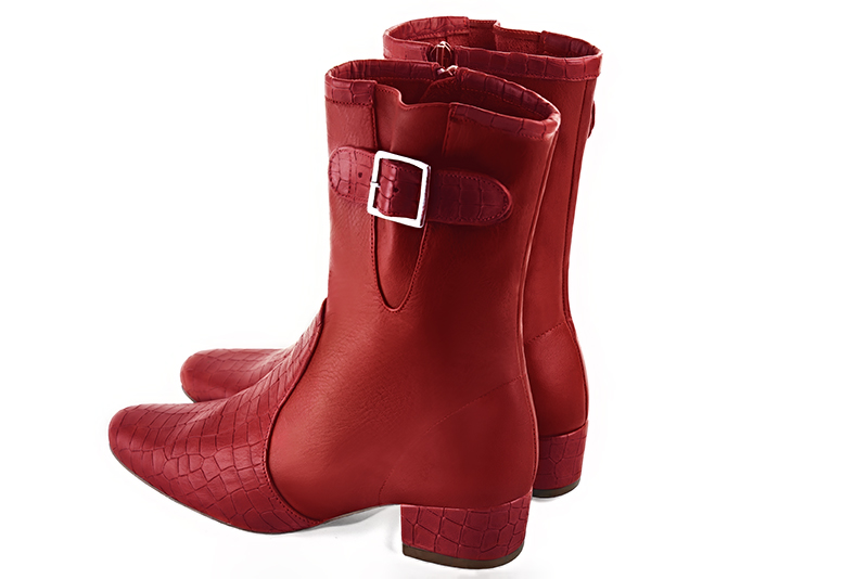Scarlet red women's ankle boots with buckles on the sides. Round toe. Low block heels. Rear view - Florence KOOIJMAN